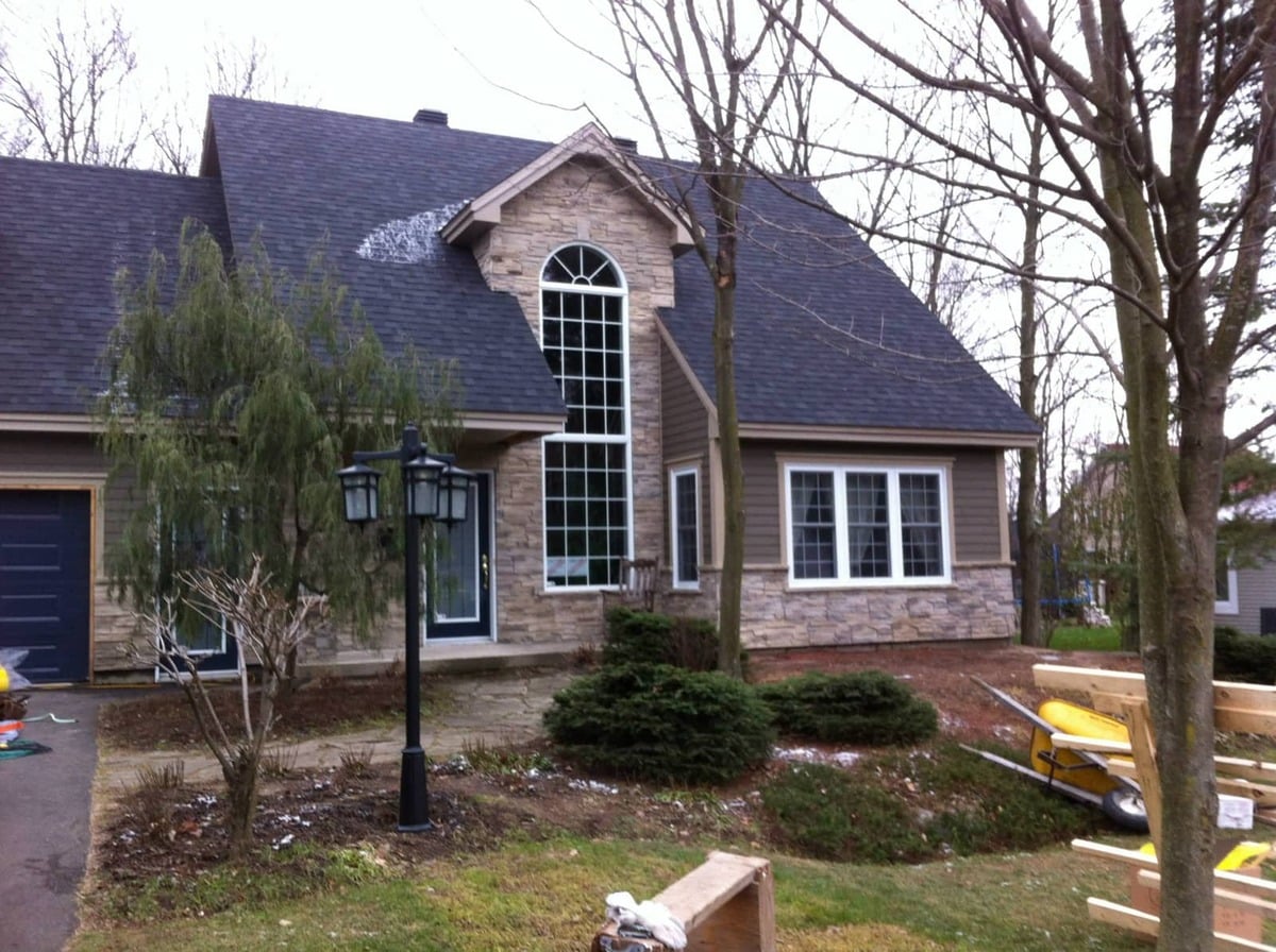 Tall arched and rectangular windows on a home